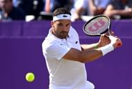 Grigor Dimitrov in action at the 2024 cinch Championships at The Queen's Club, London